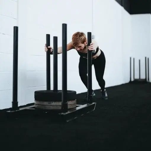 Woman pushing sled
